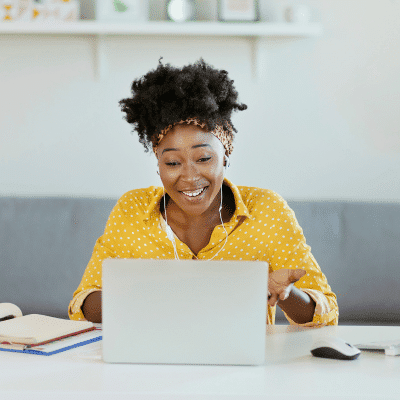 woman-working-from-home-laptop-headphones