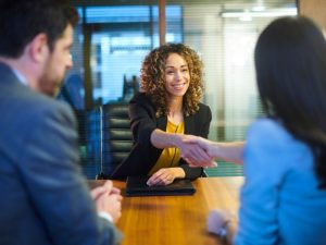 person shaking hands at interview